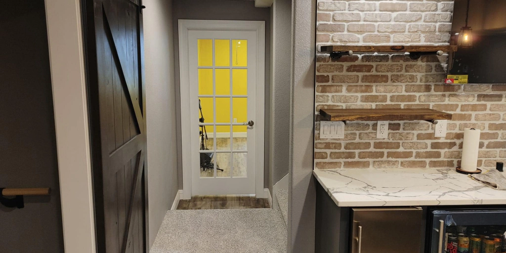 basement remodeling service newly installed door and mini food cabinets and kitchen